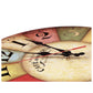 Vintage wall clock close-up showing black hands, red seconds hand, Roman numeral dial.