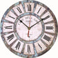 Vintage wall clock with pale dial, blue-gray distressed ring, black hands, Roman numerals.