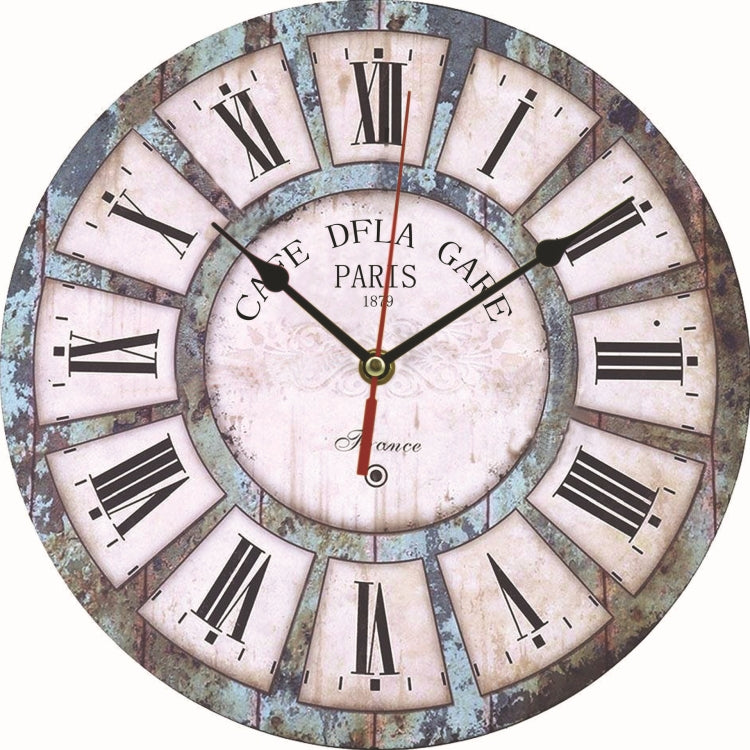 Vintage wall clock with pale dial, blue-gray distressed ring, black hands, Roman numerals.