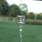 Square frame metal wind chime with small central figure and spiral wire hook