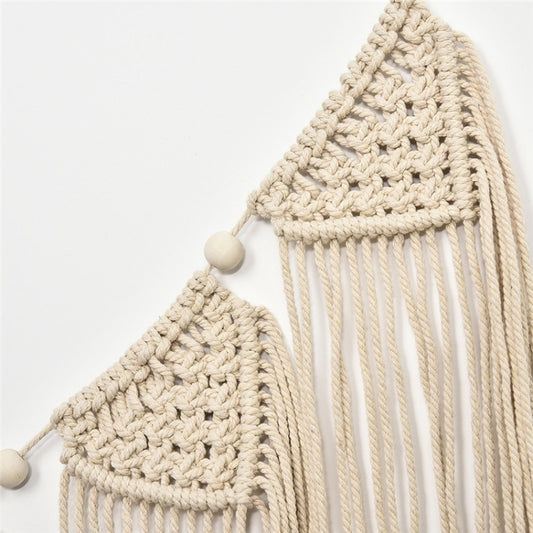 Cream crochet wall hanging corner with small wooden beads and long tassels