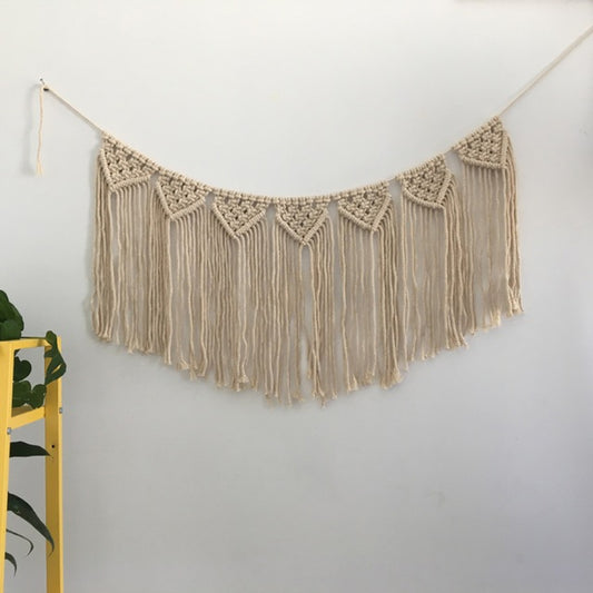 Cream crochet lace wall hanging with long fringe and hanging loops, semicircle