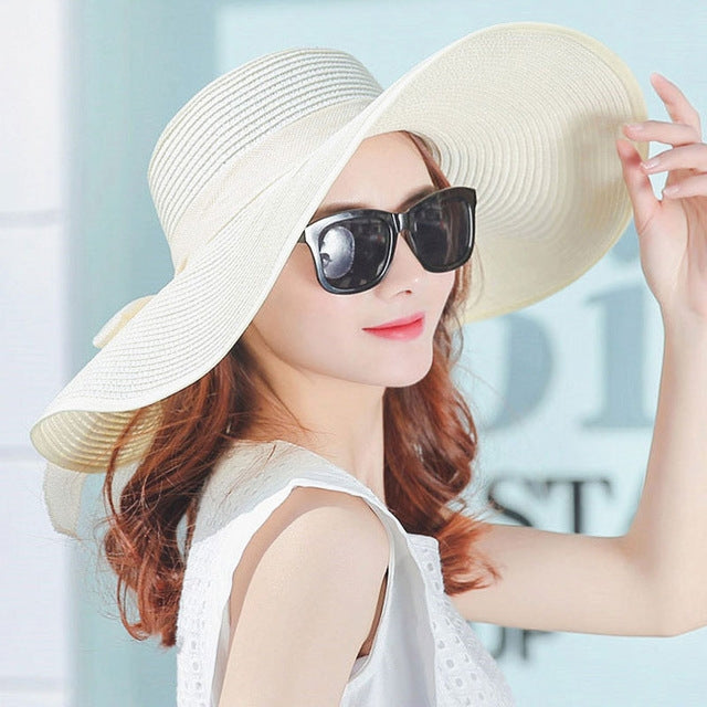 Foldable wide-brim straw summer hat, cream with wide floppy brim and ribbon band