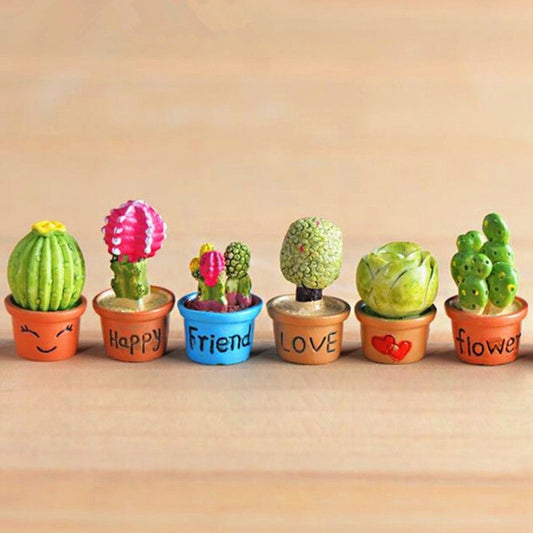Mini potted artificial succulents, including pots labeled Happy, Friend, and Love