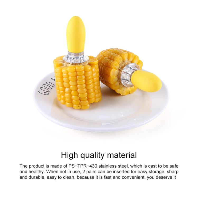 Yellow two-prong corn fork with stainless steel tines on a white plate
