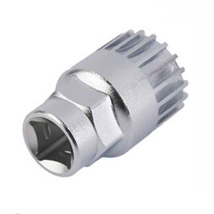 Silver socket adapter wrench with ridged edge and hex opening for bicycle repairs