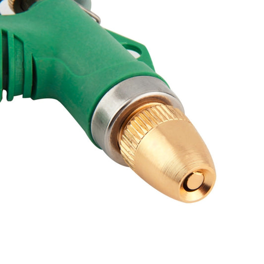Close-up of brass nozzle tip on green adjustable spray gun