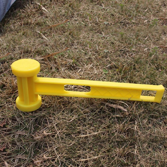 Yellow plastic tent stake hammer with flat striking face and perforated grip