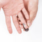 Stainless steel finger guard held between fingers, adjustable slot openings