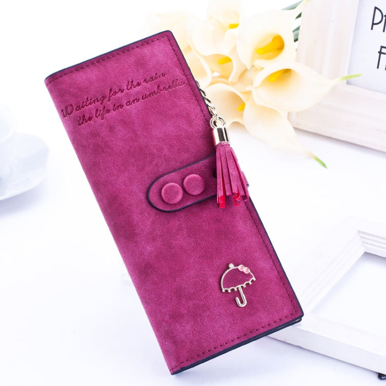 Women’s long zip wallet in dark pink/wine with umbrella emblem and tassel zipper pull