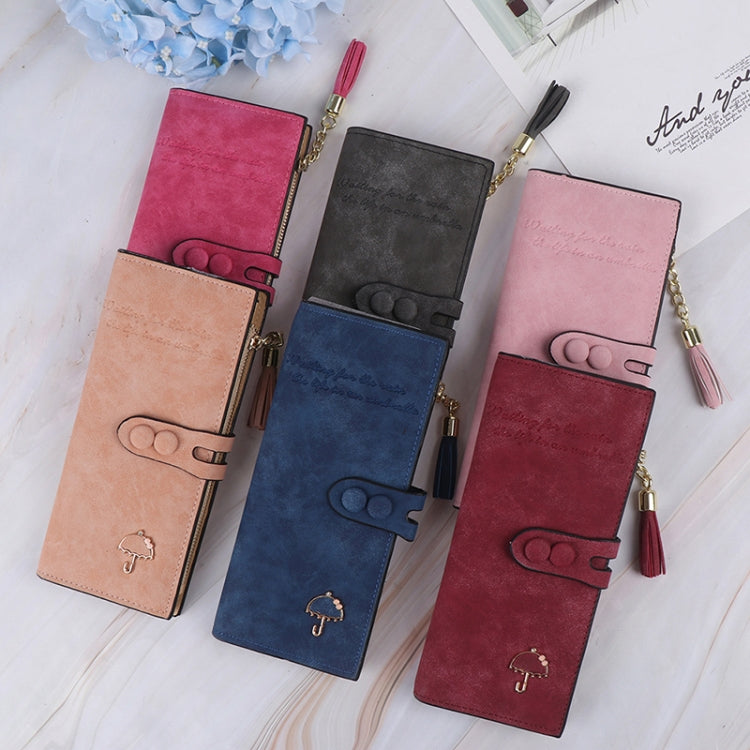 Assorted long zip umbrella wallets in multiple colors with tassel zipper pulls