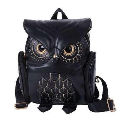 Black owl-pattern mini backpack with side straps and flap top
