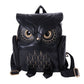Black owl-pattern shoulder backpack with front owl eyes and side straps