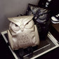 Silver and black owl-pattern mini backpacks with owl face front panels