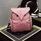 Pink owl-pattern mini backpack with embossed owl face and top flap