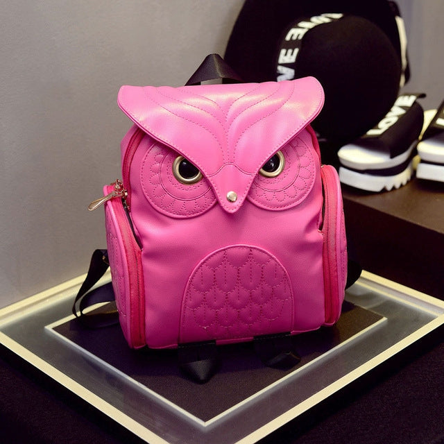 Pink owl-pattern mini backpack with owl eyes and adjustable shoulder straps