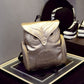 Silver and black owl-pattern mini backpacks on display with top flaps