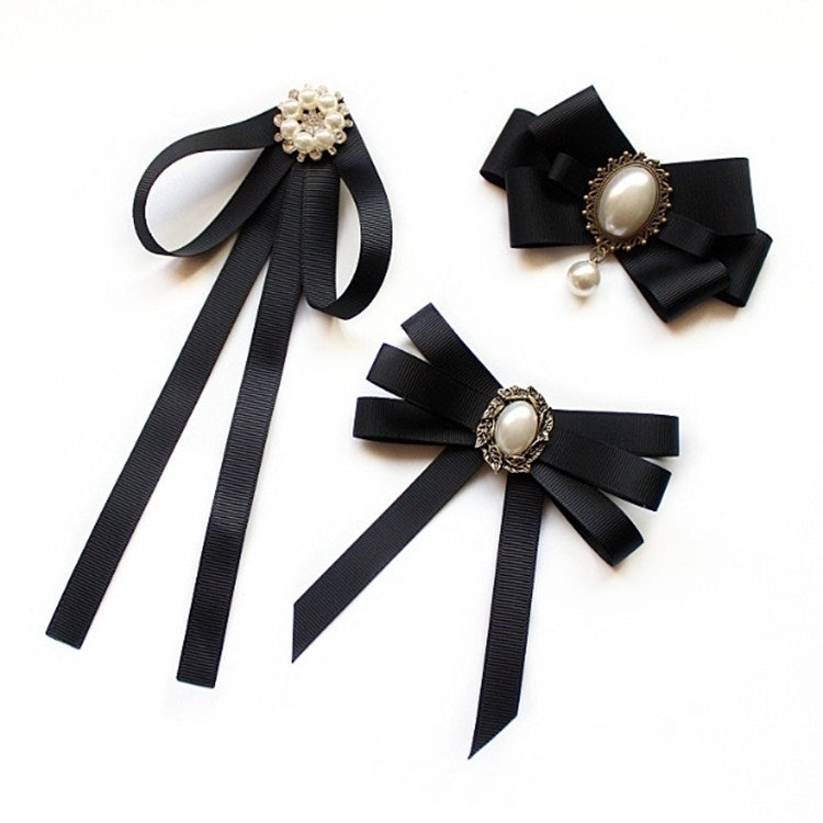 Set of three black ribbon collar bows with faux pearl centers