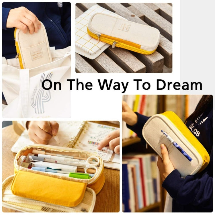 Zip canvas pencil case with mesh pocket, held for carrying school supplies