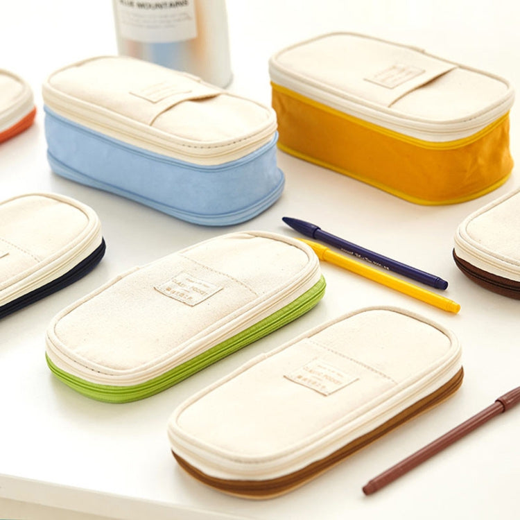 Set of zip canvas pencil cases in off-white, light blue, yellow, green, and beige