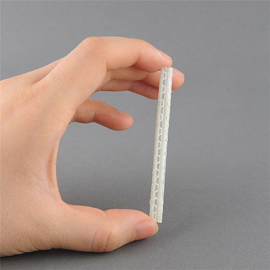 Clear bicycle spoke reflector light tube strip held in hand