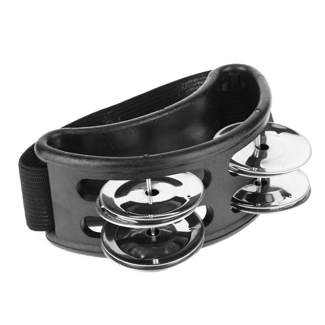 Black aluminum percussion cajon foot bell with three chrome tone discs and strap
