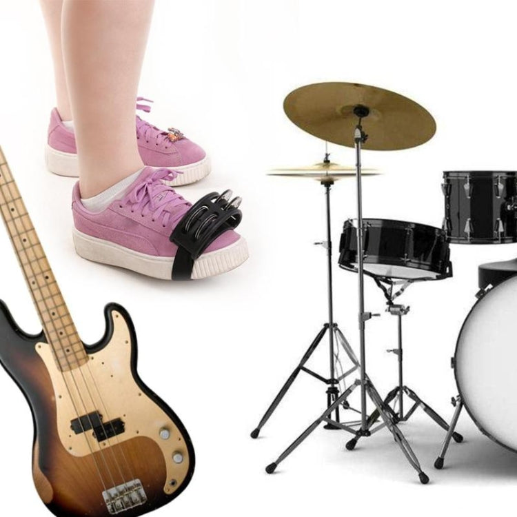 Black aluminum percussion cajon foot bell worn on sneaker with three chrome discs