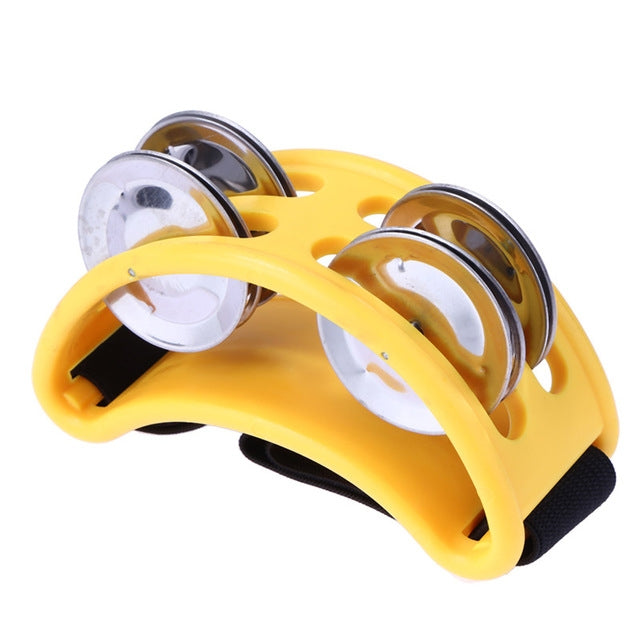Yellow aluminum percussion cajon foot bell with three chrome tone discs and strap