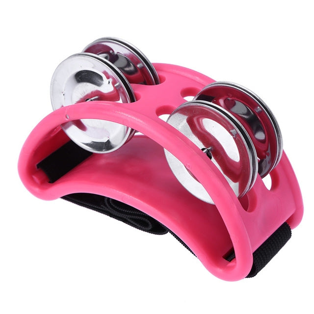 Pink aluminum cajon foot bell with two chrome jingles and strap pad