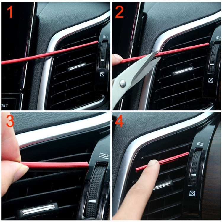 Hand installing red U-shaped car AC vent trim strip on dashboard vent grille