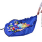 Blue drawstring toy storage bag opened flat holding assorted toys