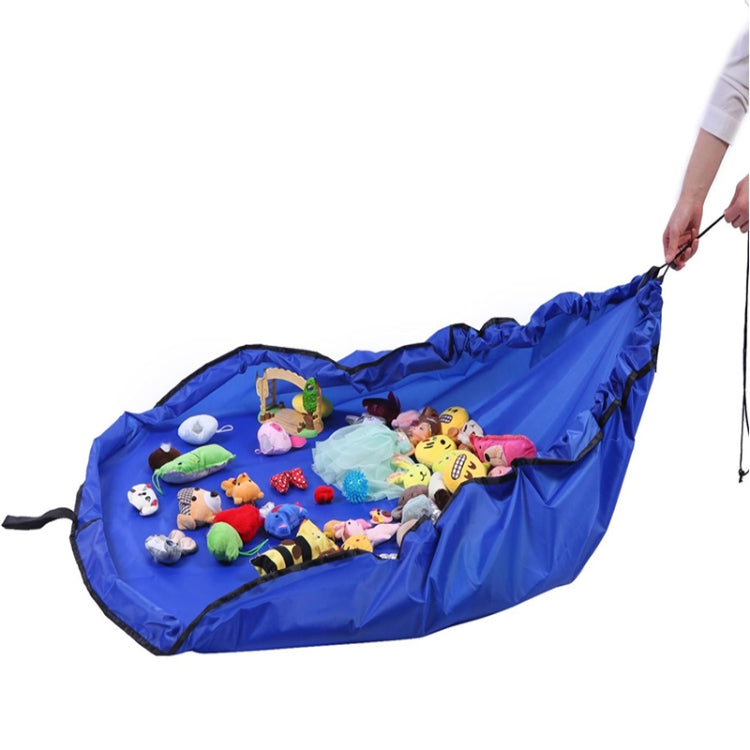 Blue drawstring toy storage bag opened flat holding assorted toys