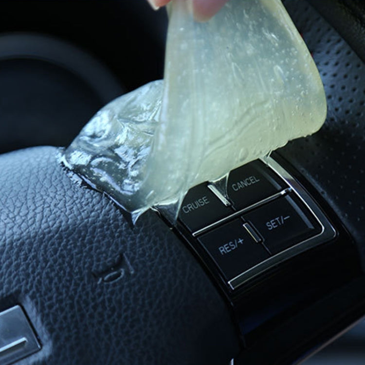 Transparent cleaning gel sticker wrapped near steering wheel cruise controls