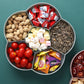 Pink flower-shaped snack storage box with transparent lid, filled snack compartments