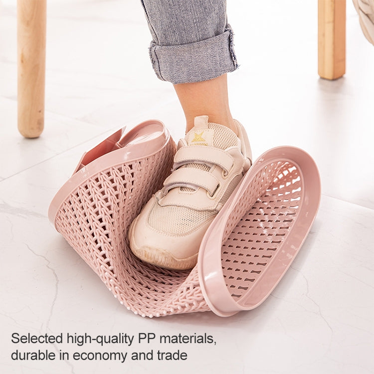 Removable plastic trash bin with lid, pink woven pattern, holding bag beside shoes