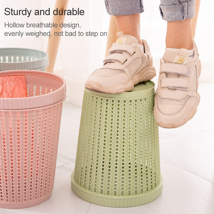 Removable plastic trash bins with lid, pink and green woven pattern, on floor near shoes