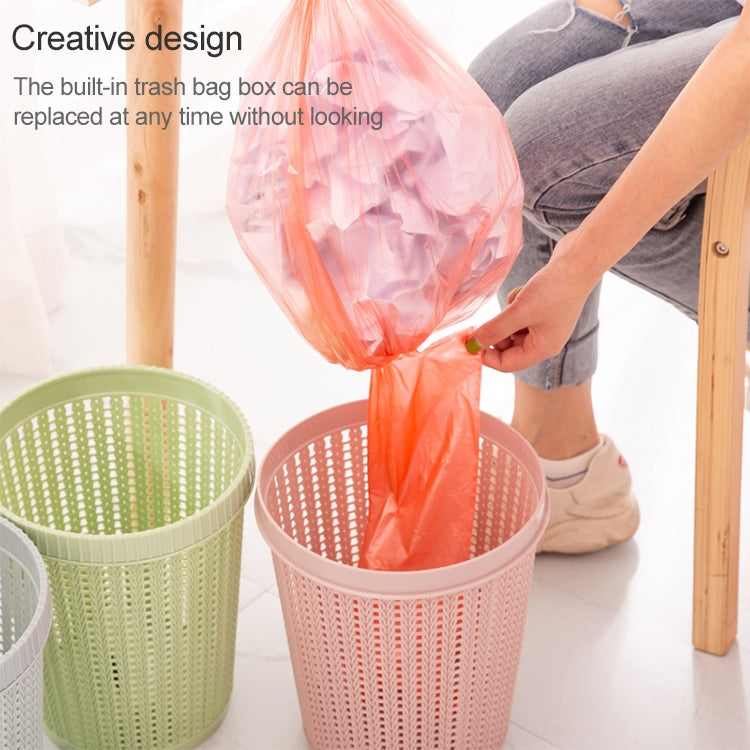 Removable plastic trash bin with lid, pink bin with bag being inserted, green bin nearby