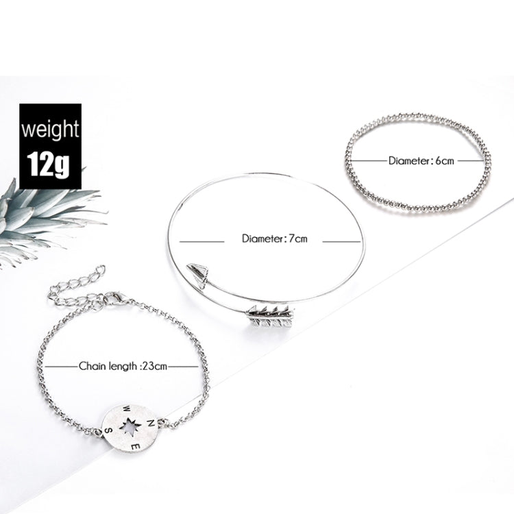 Silver-toned bracelet set; compass and arrow charms, 7cm diameter, 23cm chain length