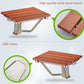 Wall-mounted folding shower chair with brown slat seat and metal hinge detail