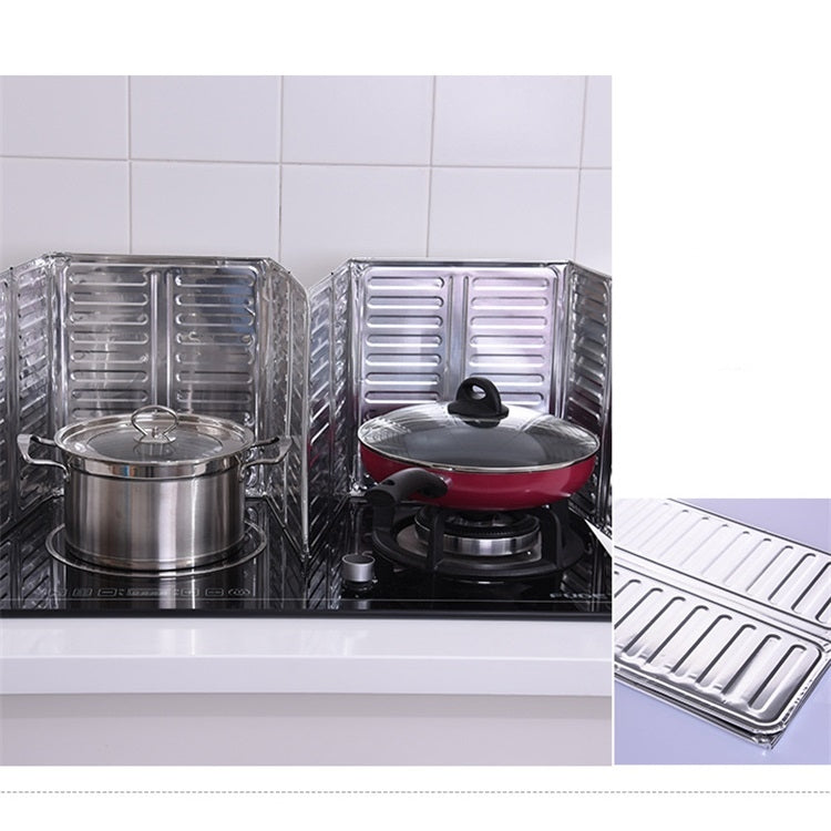 Cooktop oil shield panels installed beside pots on a stovetop
