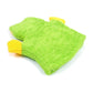 Green children’s bath glove with yellow accents, folded flat for display
