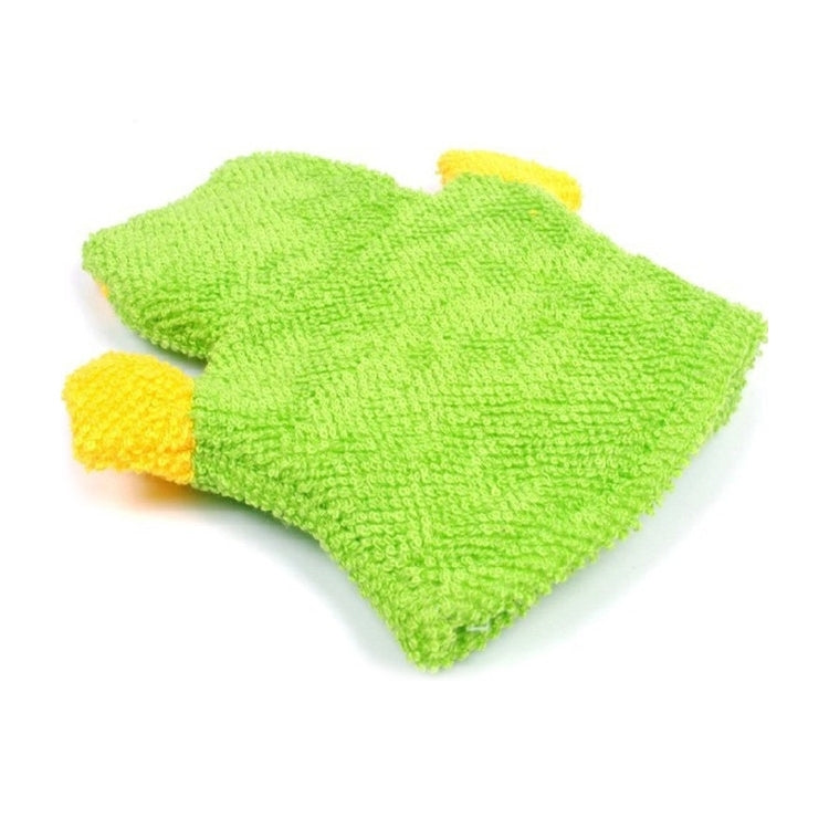 Green children’s bath glove with yellow accents, folded flat for display
