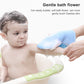 Blue bear bath glove with ruffled scrubbing sponge, held during washing