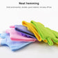 Stack of colorful cartoon children’s bath gloves: green, blue, purple, and pink