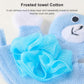 Close-up of blue bear bath glove with textured towel-cotton surface and sponge