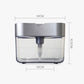 Compact soap dispenser with gray/silver top and clear container; dimensions shown