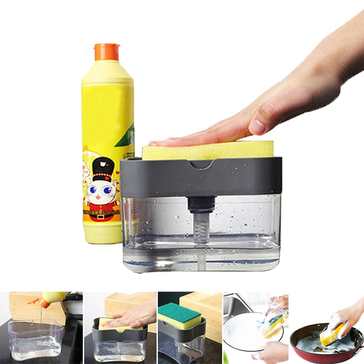Gray soap dispenser with silver press cap on counter; clear tank and yellow sponge