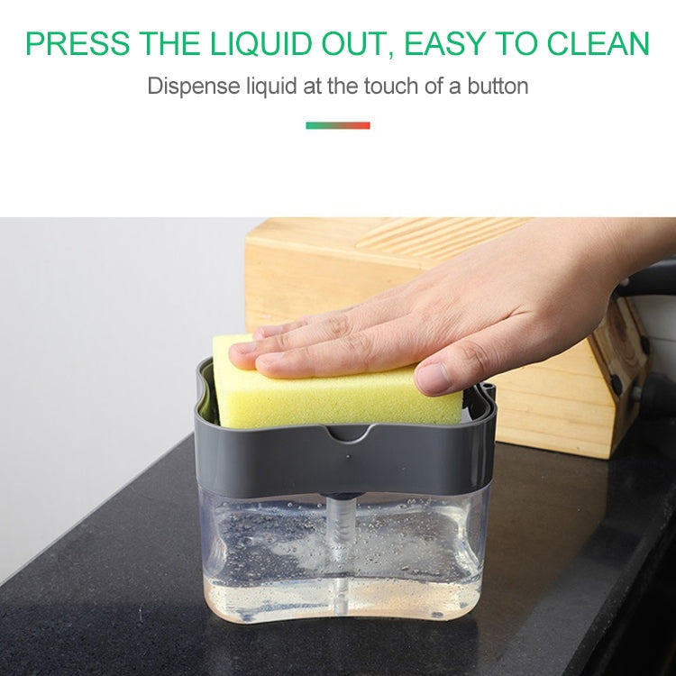 Gray soap dispenser with silver press top; hand pressing sponge into clear tank
