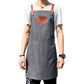 Gray denim hairdressing apron with brown leather straps and front logo patch