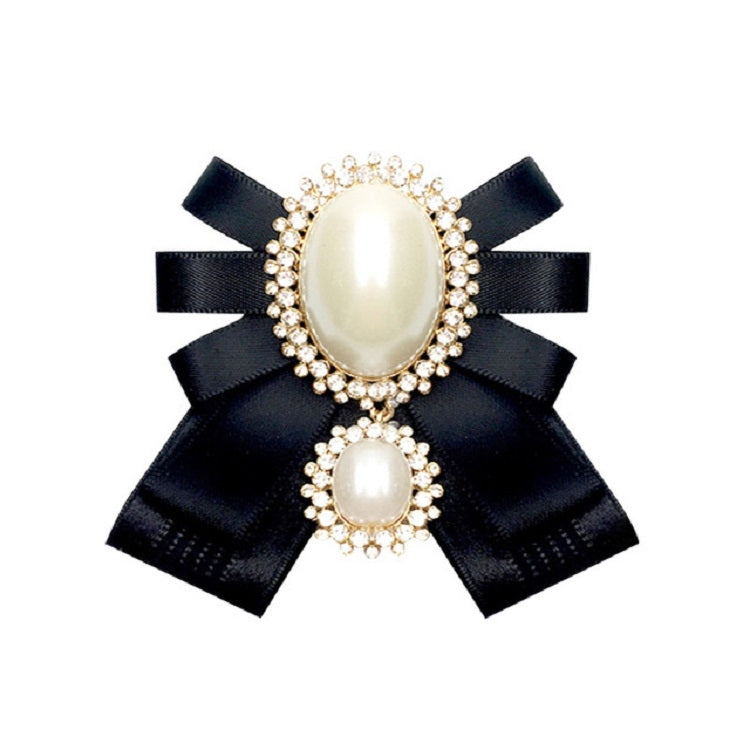 Black satin bow brooch with oval pearl centerpiece, rhinestone accents, and small pearl pin